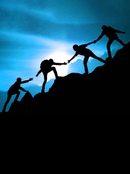Silhouette of a group of people climbing a mountain, helping each other, symbolizing teamwork under a bright blue sky