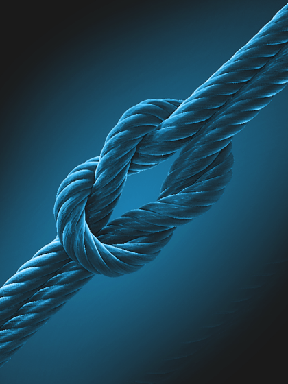 Close-up of two blue ropes tied in a strong knot, symbolizing reliability, trust, and stability.