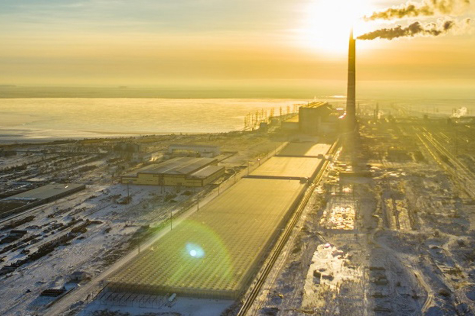Aerial view of large-scale Van der Hoeven greenhouse project integrated in industrial landscape